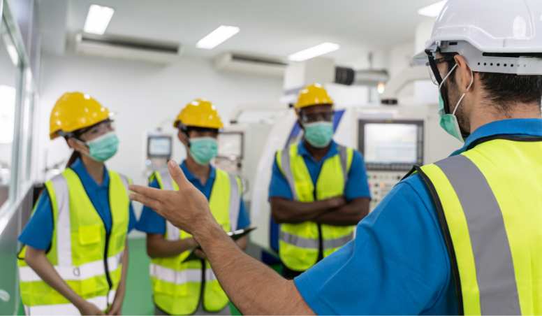 Group of employees talking about workplace safety
