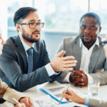 Two men in meeting wearing professional attire